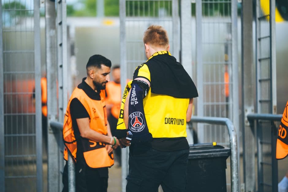 A staff member checking an attendee at an event entrance