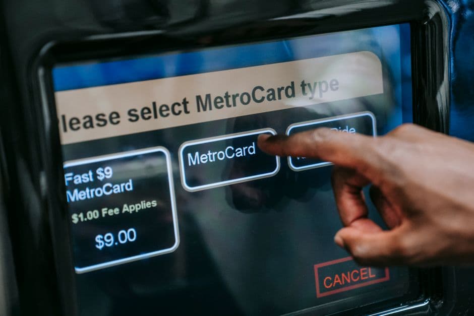 A person buying an event ticket at a ticket machine