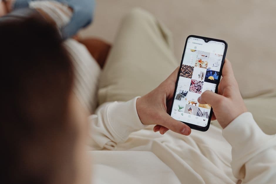 Someone scrolling social media on a phone