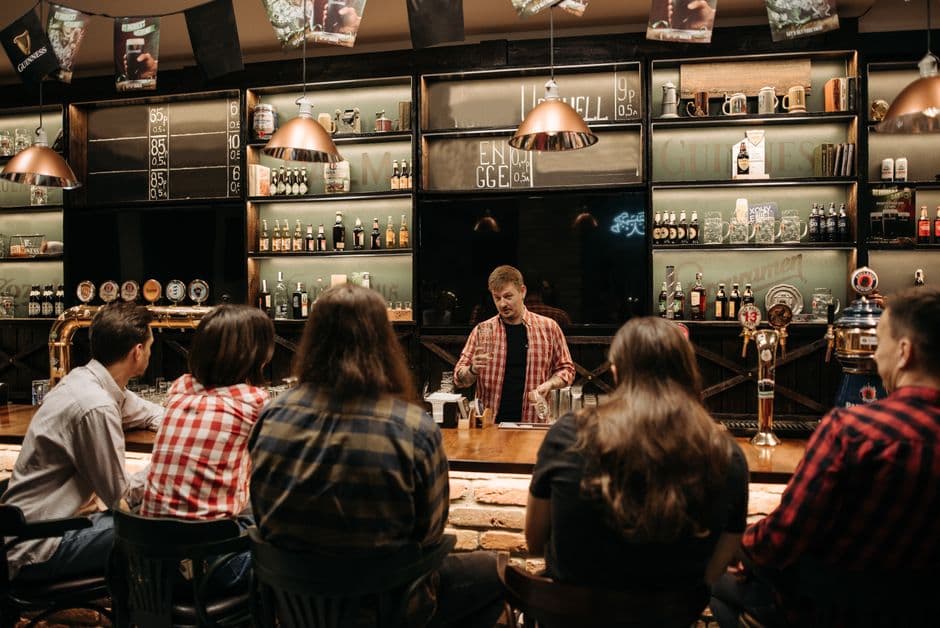 A crowd at tables during a trivia night at a pub