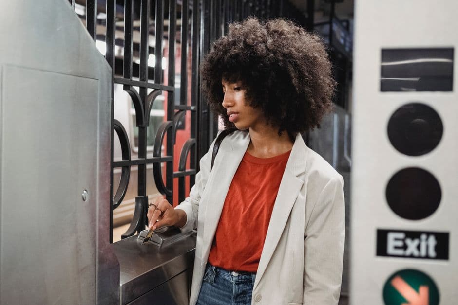 A volunteer scanning a ticket at the door on a phone