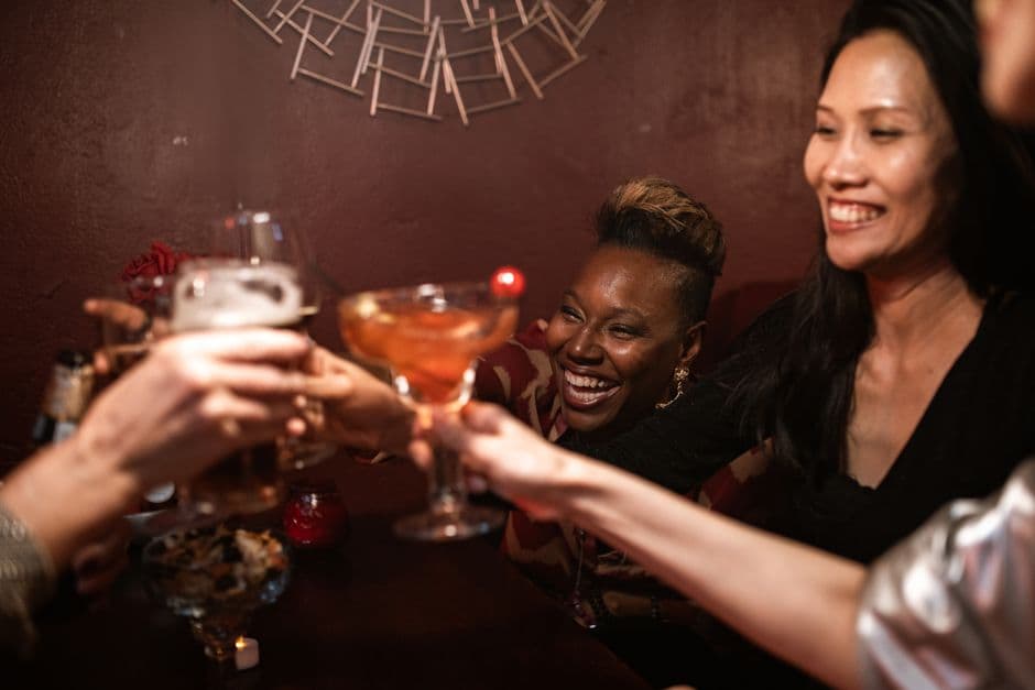 Workmates out at a bar, a popular work Christmas party idea