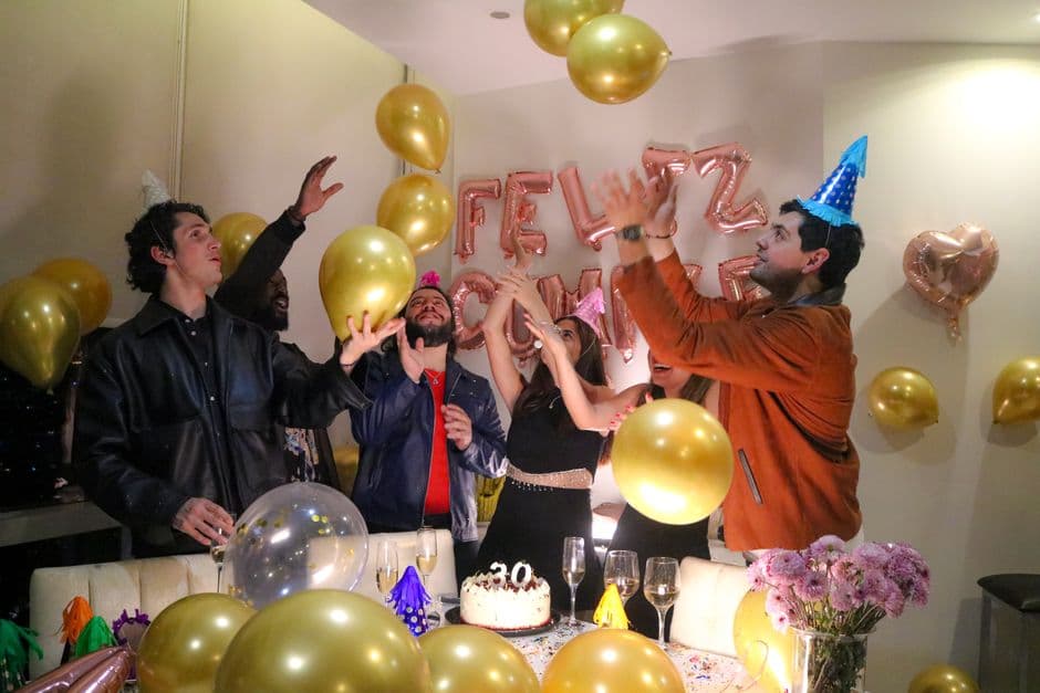 Friends celebrating together at an 18th birthday party
