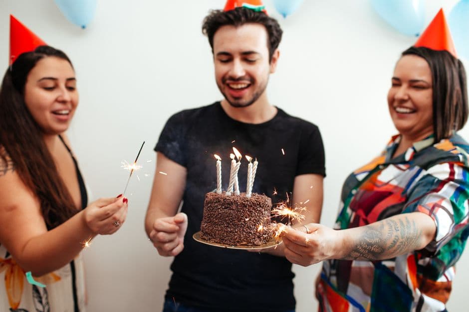 Friends celebrating together at a 21st birthday party with sparklers