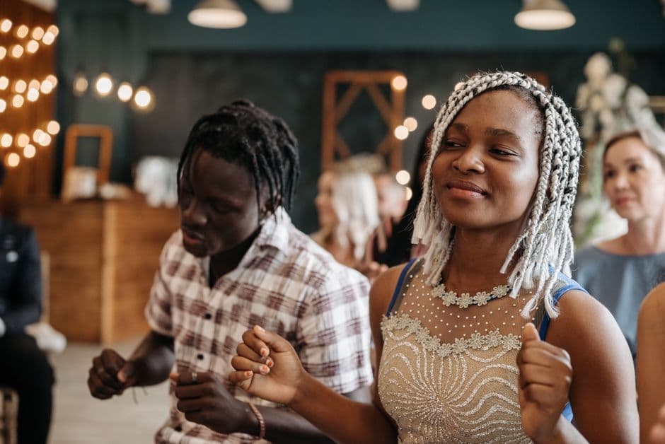 A newly engaged couple celebrating with friends at their engagement party