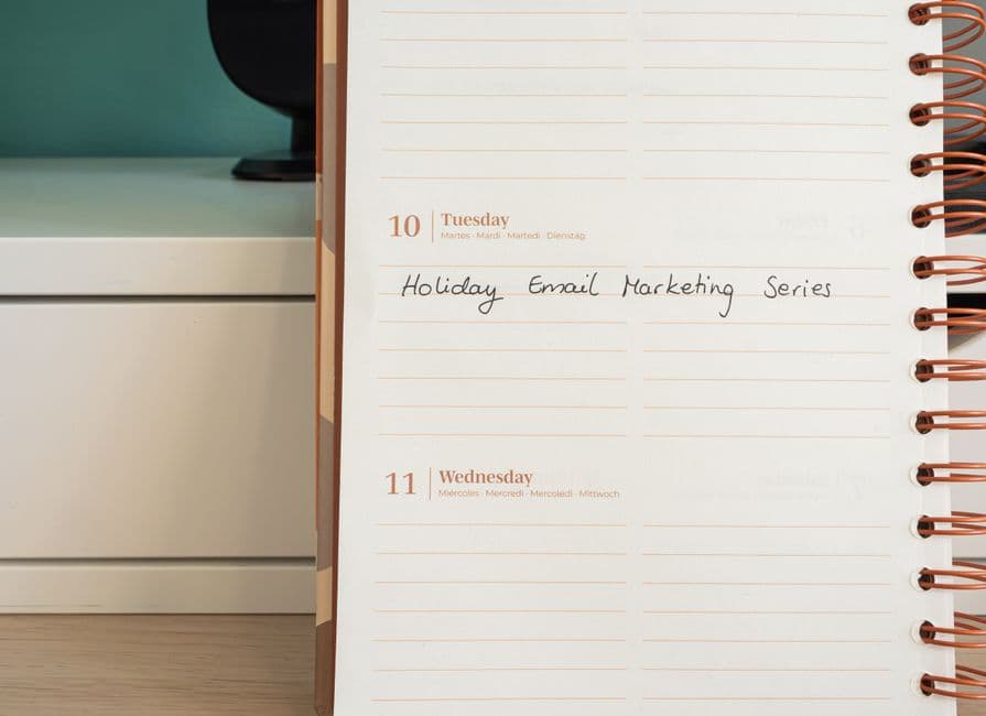 An organiser working through an event planning checklist at a desk